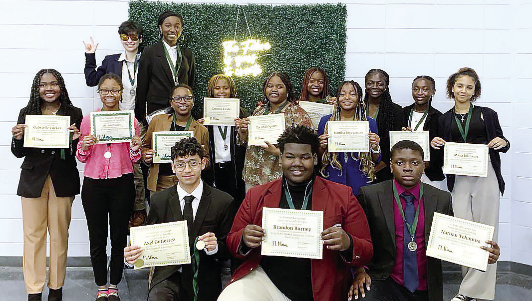 Students who attended the Georgia Speaking Competition pose with their awards. CONTRIBUTED