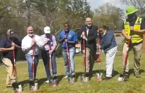 Baldwin County Commissioner Emily C. Davis (second from right) shares a few remarks before initiating the ground breaking with Commission Chairman Johnny Westmoreland, District Commissioner Kendrick Butts, City Manager Carlos Tobar and representatives of the contractor, RDJE, Inc., on Lee Street off Vinson Highway for the Community Development Block Grant sewer line upgrades. SCREENSHOT FROM BOC FACEBOOK