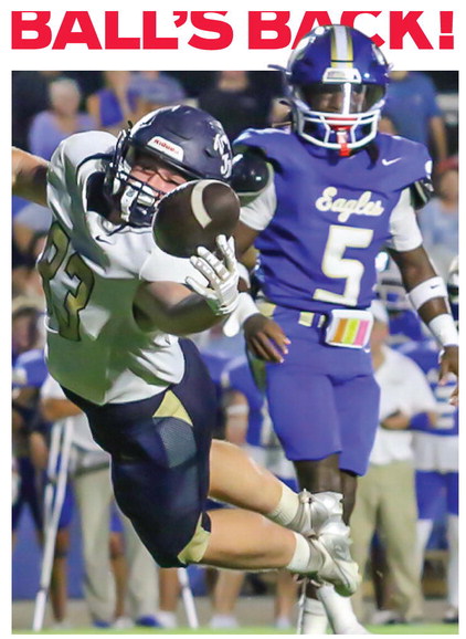 Parker Soltay makes a diving attempt for John Milledge.