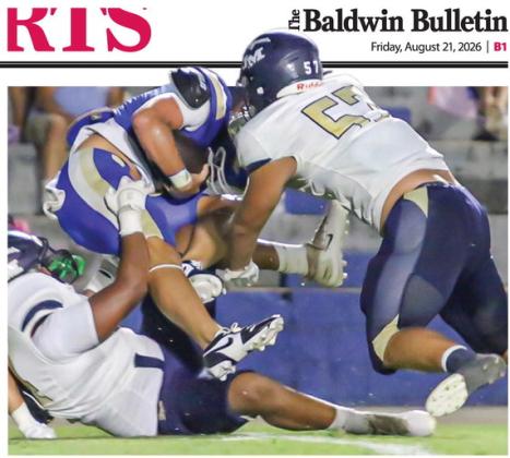 JMA’s Kellen Eady (57) and the Trojans defense swarm the Eagles starting quarterback in last Friday’s 31-7 win. TREY NORRIS/Staff