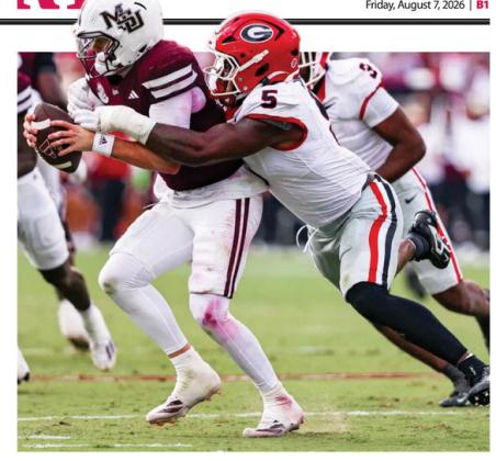 Georgia inside linebacker Raylen Wilson (5) tackles Mississippi State quarterback Blake Shapen during a game in Starkville last season. LANCE McCURLEY/Staff