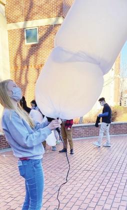 Lillian (Special Education Major) is testing hot air balloons created by the High Achievers Program. CONTRIBUTED