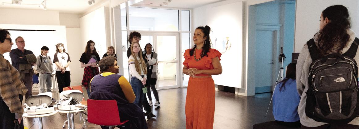 Brazilian artist Cândida Borges speaks to students and the public during opening night at the Transeunti Mundi Derive 01 exhibition in the Leland Gallery. CONTRIBUTED