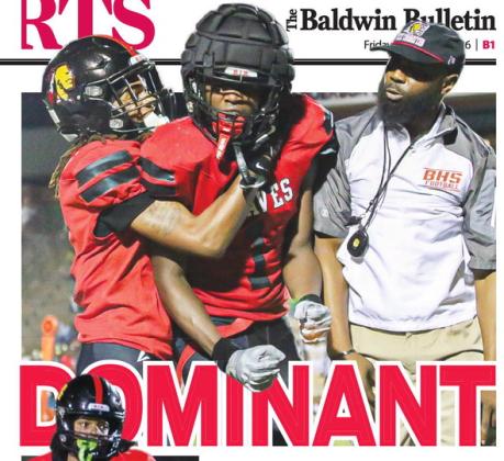 Above, Baldwin’s BJ Armstrong Jr. celebrates with head coach Kevin Patterson and teammates after forcing a fumble vs Washington County.