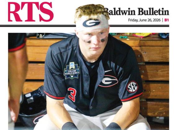 Georgia catcher Daniel Jackson sits in the dugout contemplating what might have been after the Bulldogs’ 11-4 loss to Oklahoma on June 17. LANCE McCURLEY/Staff