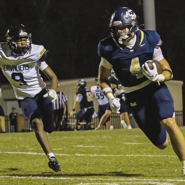 Asa Wall breaks away for one of his four touchdowns and 150-yards of offense vs Mount de Sales last Friday in Milledgeville. TREY NORRIS/Staff