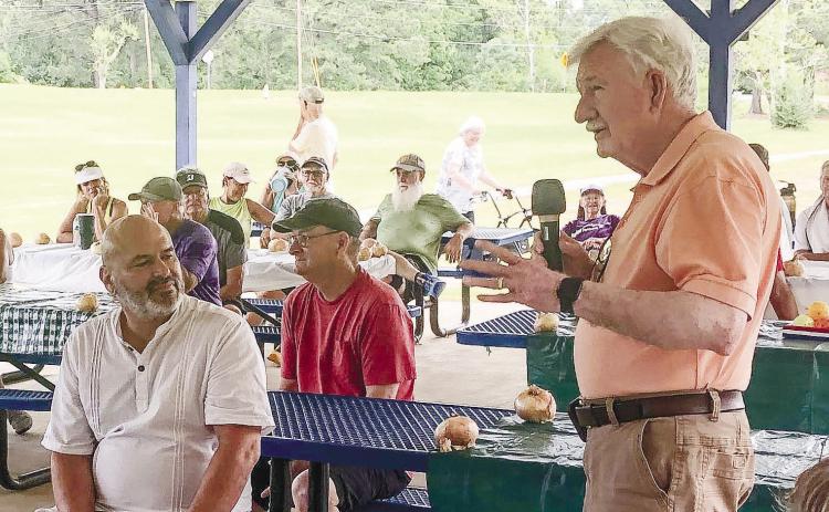 Commissioner Henry Craig (right) speaks to the pickleball group. County Manager Carlos Tobar (seated left) joined him for the lunch. GREENBERRY MOORE/Staff