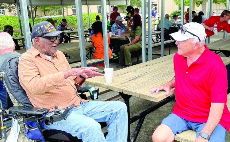 A Lake Oconee Elks member (right) visits with a GWVH resident in Milledgeville. CONTRIBUTED