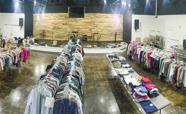 An overview of the racks and tables full of clothing that were donated by the church in one week. CONTRIBUTED