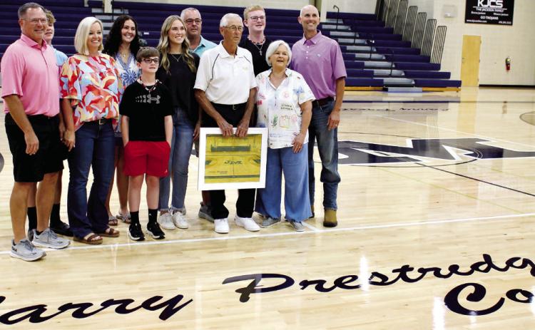 Larry Prestige and his family stand on the newly named “Larry Prestige Court” in the John Milledge Academy gymnasium. MATT SMITH/Staff