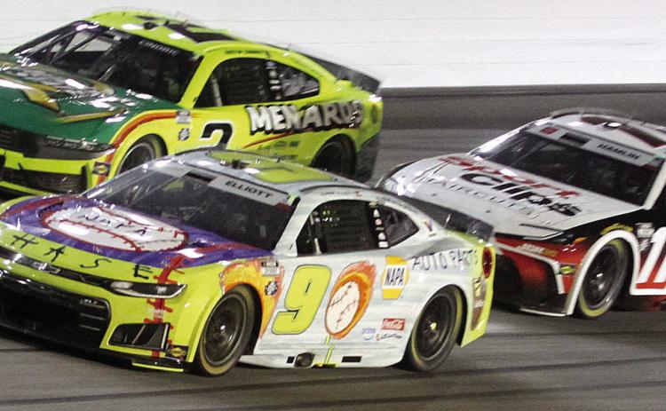 Chase Elliott (9) battles for position coming off turn four during Sunday’s Quaker State 400. He led twice for five laps. BRAD HARRISON/Staff