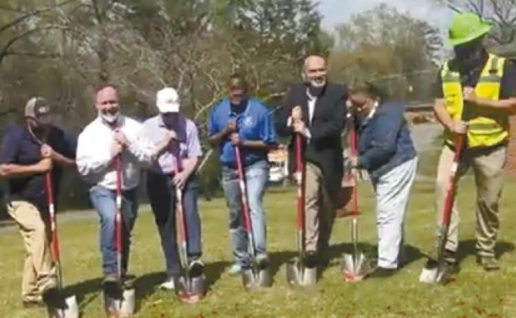 Baldwin County Commissioner Emily C. Davis (second from right) shares a few remarks before initiating the ground breaking with Commission Chairman Johnny Westmoreland, District Commissioner Kendrick Butts, City Manager Carlos Tobar and representatives of the contractor, RDJE, Inc., on Lee Street off Vinson Highway for the Community Development Block Grant sewer line upgrades. SCREENSHOT FROM BOC FACEBOOK