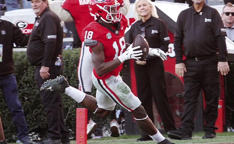 Georgia linebacker Chris Cole (18) recovered a UMass fumble for a scoop and score. BRAD HARRISON/Staff