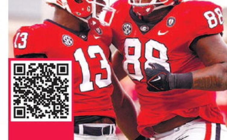 Georgia defensive linemen Mykel Williams (13) and Jalen Carter (88) celebrate during the win against Tennessee. TONY WALSH/UGA Athletics