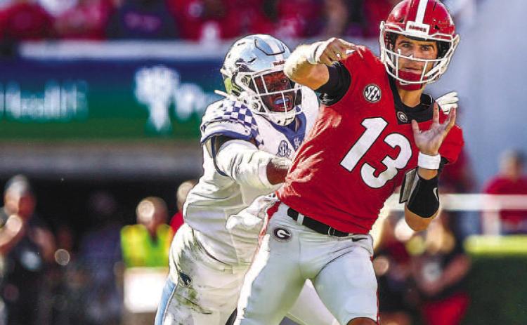 Quarterback Stetson Bennett went 14-20 passing in 2021 against Kentucky for 250 yards and three touchdowns with no interceptions for an average of 12.5 yards per play. He also rushed three times for 22 yards. MACKENZIE MILES/ UGA Athletics