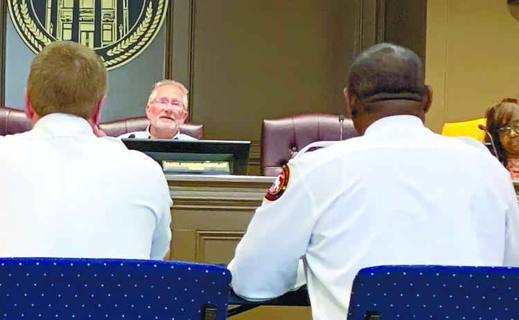 Mayor Pro-tem Steve Chambers discusses with Milledgeville Fire Rescue how they could get return on the investment of new employees. BAILEY BALLARD/Staff