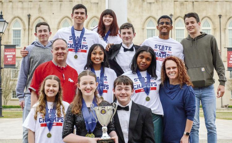 The GMC Prep literary team shows off its trophy marking a ninth-consecutive State Literary Competition victory. COURTESY OF GMC