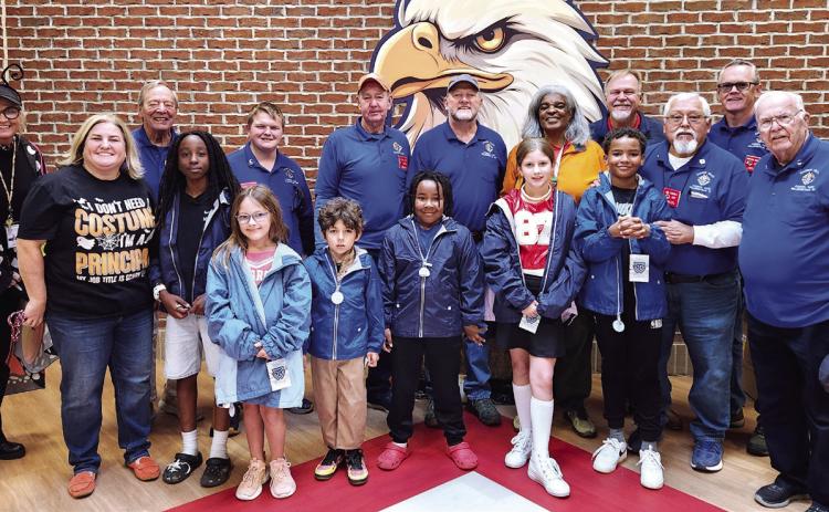 Late last month, the Knights of Columbus Council No. 9458 at Sacred Heart Catholic Church in Milledgeville delivered 48 new coats to students at Putnam County Elementary School. The donation to PCES kids was part of a nationwide Coats for Kids program by Knights of Columbus and was coordinated through Rev. Dr. Avis Williams, the community liaison for Putnam Schools, and Elementary School Principal Whitney Smith.