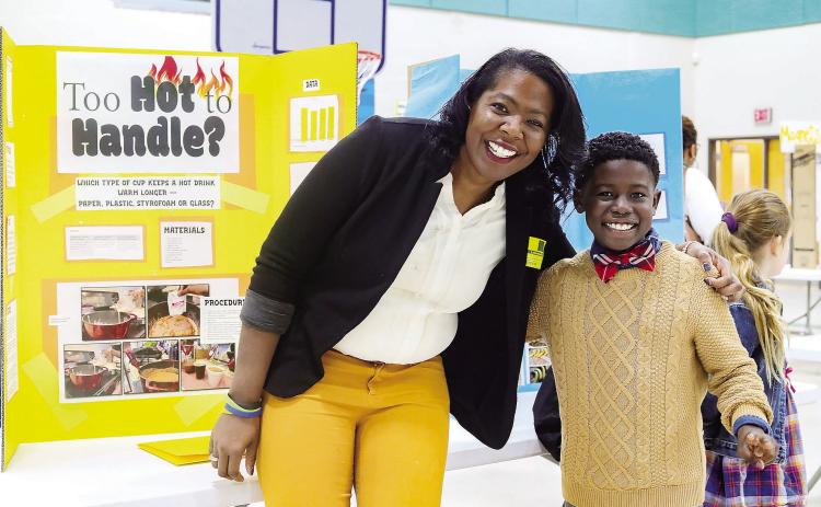 First grader Brayden Linder (right) poses with his mother Natalie, who helped guide Brayden through the scientific method. ERIC JONES/Contributed