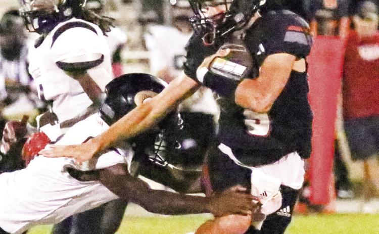 Bulldogs quarterback Logan McMillan made his first start after returning from injury and, despite the loss, had a solid night for GMC Prep. TREY NORRIS/Staff