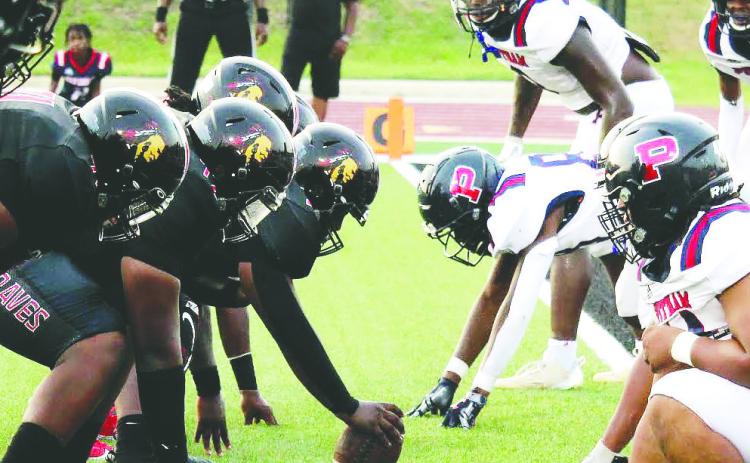 The Baldwin County Braves (left) faced off against the Putnam War Eagles Aug. 25, and evened up the all-time series at 4-4-1 with a 33-13 victory at home in Milledgeville. TREY NORRIS/Staff