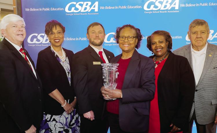 Baldwin County Board of Education member Wes Cummings, Superintendent Dr. Noris Price, board member John Jackson, board chair Dr. Gloria Wicker, board vice-chair Shannon Hill and board member Lynn Chandler pose with the 2023 GSBA Governance Team of the Year Award. ERIC JONES/Contributed