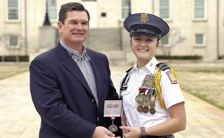 U.S. Rep. Austin Scott of Georgia's 8th Congressional District presenting the Congressional Award Bronze Medal to Georgia Military College Preparatory School (GMC Prep) Cadet Danica Resha. CONTRIBUTED
