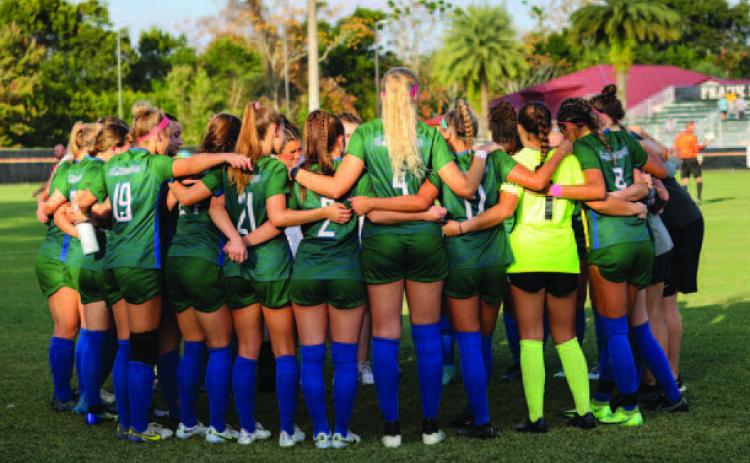 GCSU soccer huddles before PBC tournament game. Courtesy of GCSU