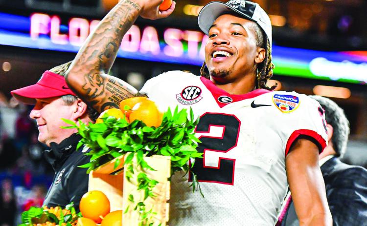 Georgia running back Kendall Milton celebrates after the Bulldogs defeated Florida State. CHARLES JORDAN/Staff
