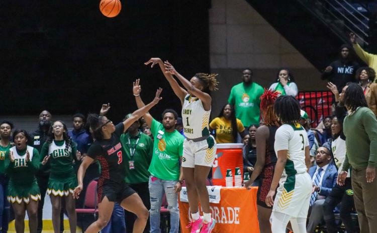 Griffin guard Leah Turner (1) fires a 3-pointer over Baldwin's Madison Ruff in the third quarter of the Class AAAA state championship game on Wednesday at the Macon Centreplex. BRENDAN KOERNER/Staff