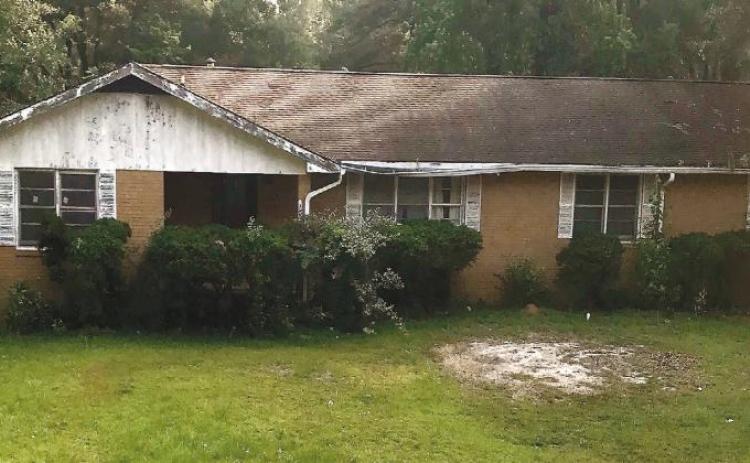 The scenery around this house on the corner of Pennington Road and Peachtree Avenue in Milledgeville seems peaceful after multiple law enforcement agencies conducted a raid on it early Tuesday morning. CONTRIBUTED