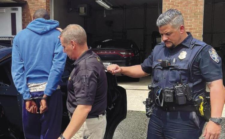 Officers with the Milledgeville Police Department arrest Tabish Nigel Goddard for the murder of a Putnam County man. MILLEDGEVILLE POLICE FACEBOOK PAGE