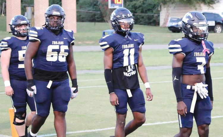 JMA co-captains Brandon Watson (66),  Jayden Dorsey (11) and Bud Veal (3) walk out on the field prior to the game’s start.