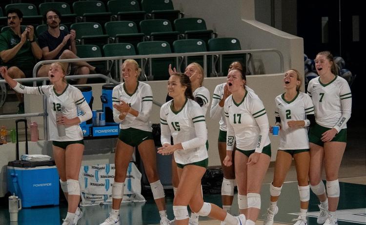 The Lady Bobcats celebrate after winning a point in a loss to Mississippi College. CONTRIBUTED