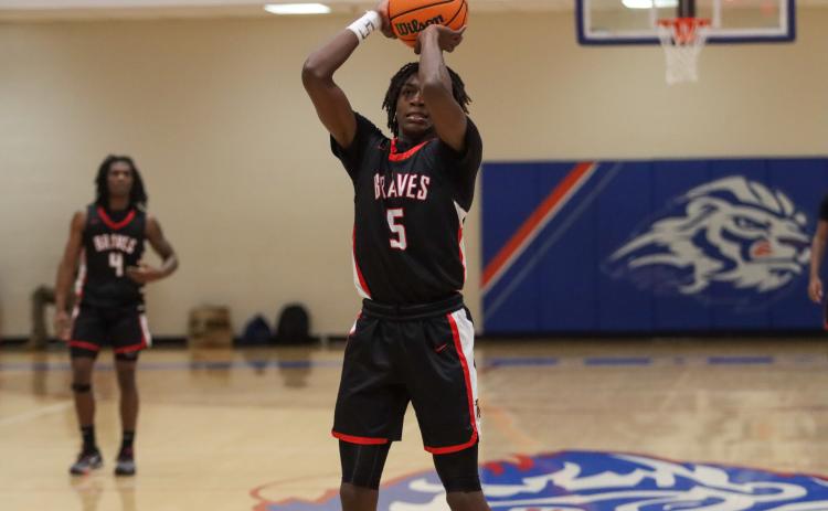 Baldwin sophomore Omari Woodard (5) stepped up in place of Tre Lawrence last week against Southeast Bulloch and posted a double-double with 11 points and 11 rebounds. LANCE MCCURLEY/Staff