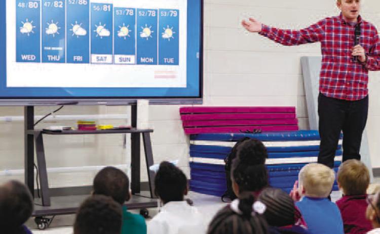 WMAZ Meteorologist Alex Forbes teaches students about his profession. CONTRIBUTED