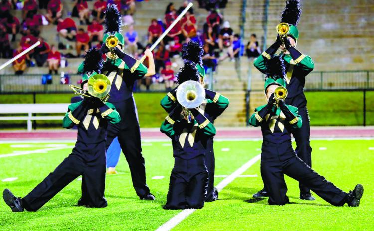 Wesleyan High School poses during its performance on the Baldwin High School football field.