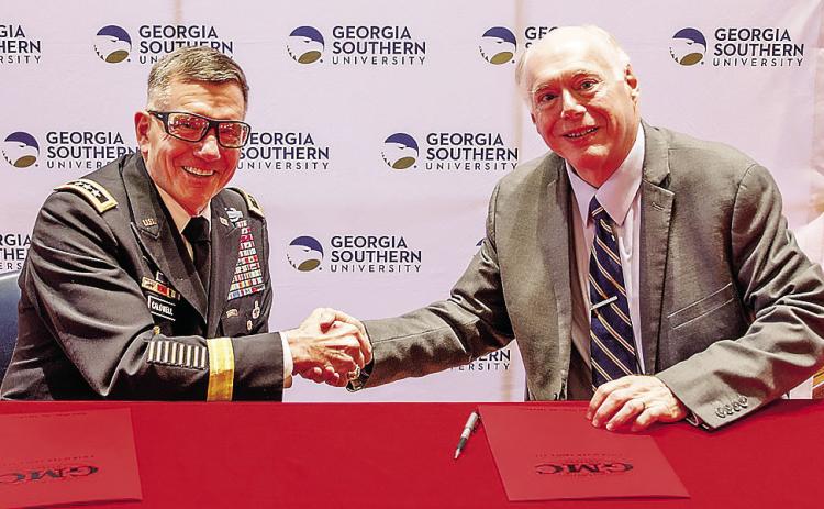 President of Georgia Military College Lt. Gen. William B. Caldwell IV, USA (Ret.), and Provost and Executive Vice President of Georgia Southern University Carl Reiber shake hands. COURTESY OF GMC