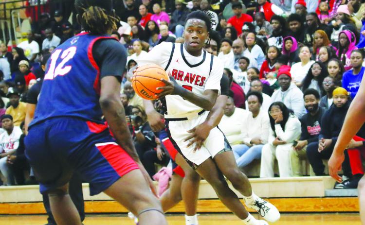 Baldwin senior Karez Demory led the Braves with 19 points and eight rebounds in last Saturday night’s two-point loss to Cross Creek in the GHSA AAA Region 4 championship game. TREY NORRIS/Staff
