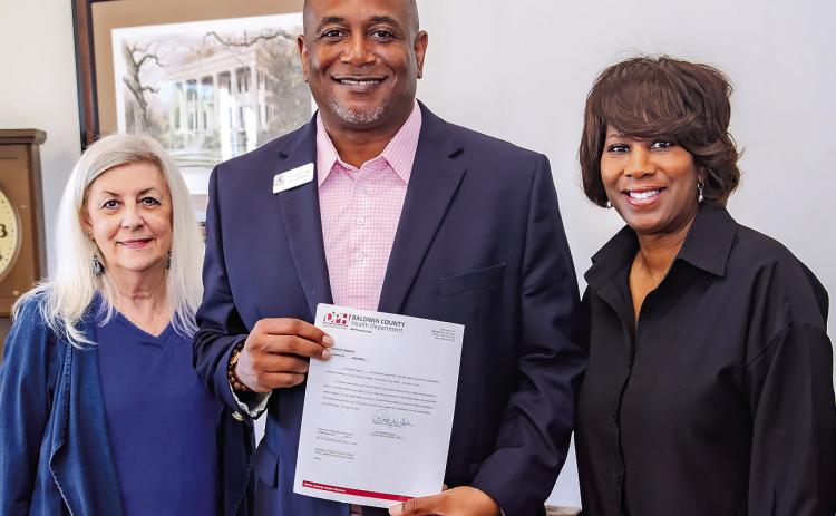 Baldwin County School District Deputy Superintendent Dr. Rodney Tyson (center) was sworn in as a member of the Baldwin County Health Department Advisory Council. CONTRIBUTED