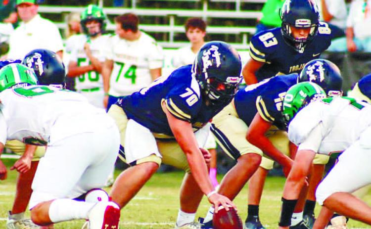 John Milledge Academy center Rhen Prior (70) gets set to snap the ball against the Patriots. LANCE MCCURLEY/Staff