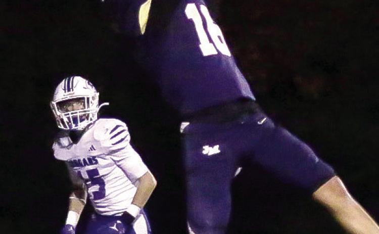 A JMA receiver makes an acrobatic catch in last week’s game against the visiting Piedmont Cougars. TREY NORRIS/Staff