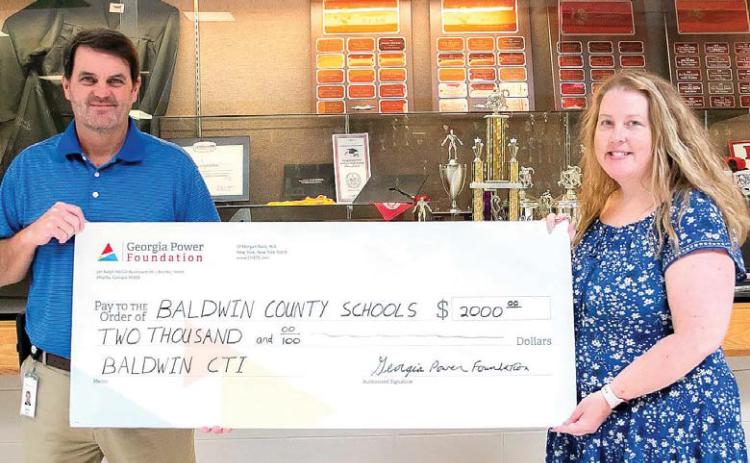 Georgia Power Foundation Area Manager Greg Tyson was on hand to deliver the check, which was formally received by Ms. Rogers, BHS Principal Jason Flanders, and BCSD Superintendent Dr. Noris Price. ERIC JONES/Contributed