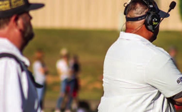 Trojans’ head coach JT Wall watches as his offense takes the field in a contest earlier this season. LANCE MCCURLEY/Staff