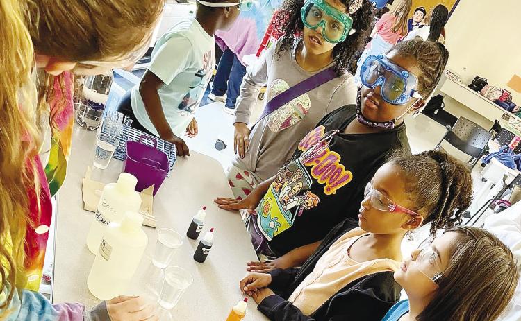 Special guest Dr. Catrena Lisse leads campers through a Science Magic Show. | CONTRIBUTED