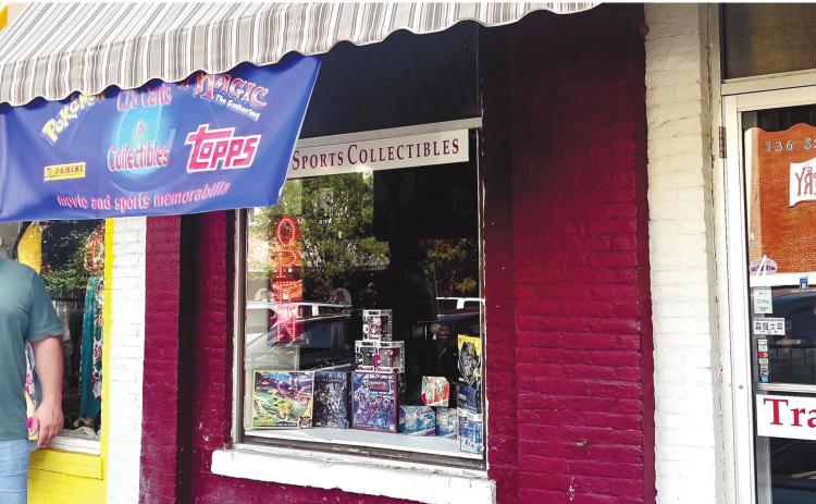 Chris Jameson, the owner of CJ’s Cards and Collectibles, outside of his shop in Milledgeville.