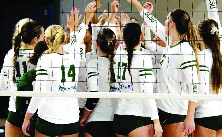 The GCSU volleyball team high fives each other after a match. MCKINSEY LEWIS /Contributed