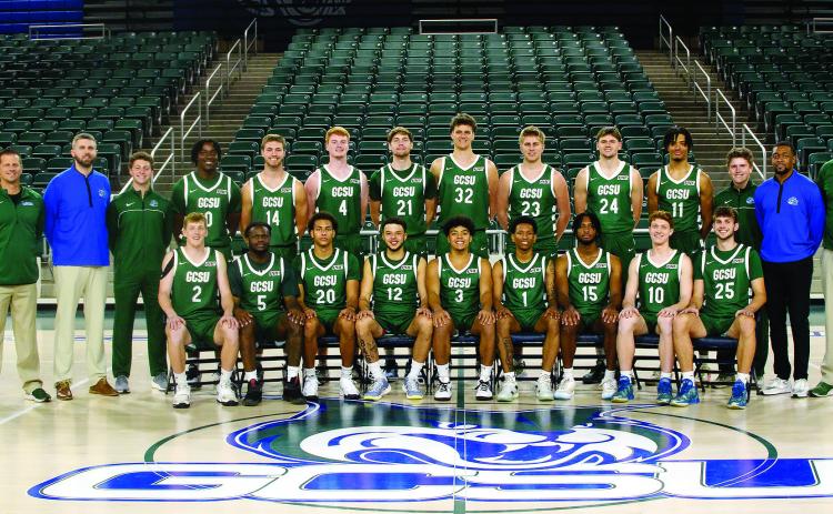 Georgia College &amp; State University’s 2024-25 men’s basketball team is pictured on its home court in the Centennial Center. COURTESY OF GCSU