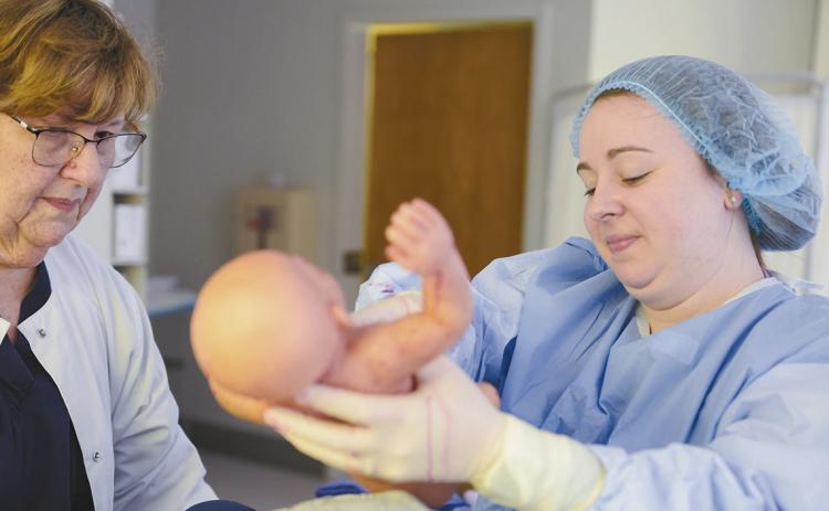 A student undergoes a birthing simulation at GCSU’s Simulation and Translational Research Center at Atrium Health Navicent Baldwin in Milledgeville. COURTESY OF GCSU