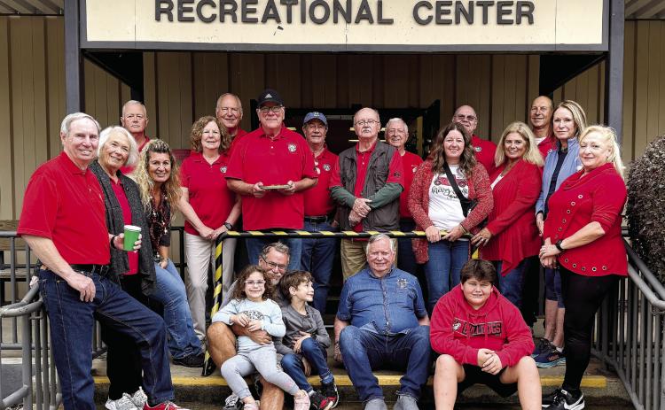 Lake Oconee Elks Lodge members and volunteers posed on the steps of the Kenneth W. Birdsong Recreational Center after the party. CONTRIBUTED